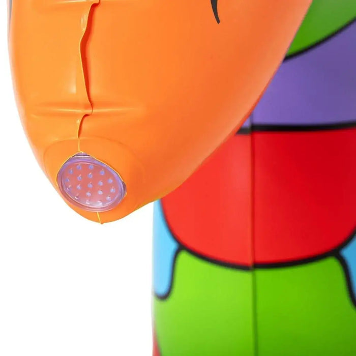 Close-up of jumbo inflatable giraffe sprinkler nose with colorful safari design