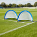 Set of two blue pop-up football goals on a grass soccer field corner