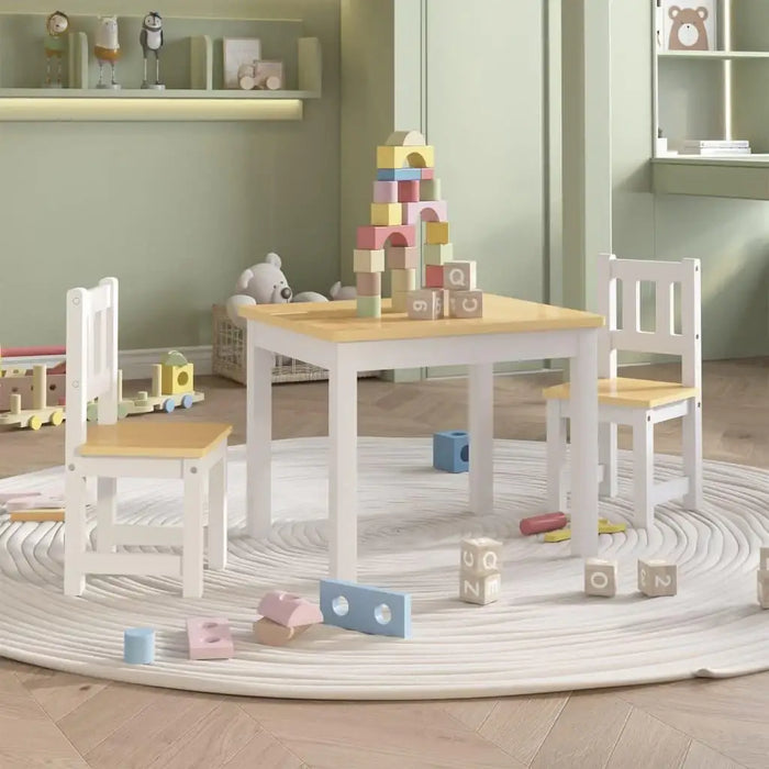 Kids table and chair set in white and beige with wooden blocks in playroom setting