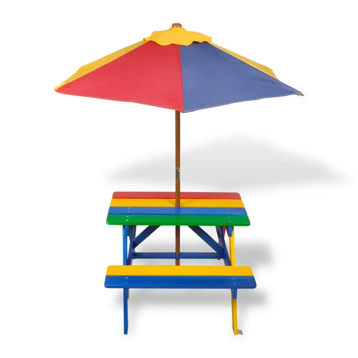 Kids wooden picnic table and bench in rainbow colors with a large red, yellow, and blue parasol.