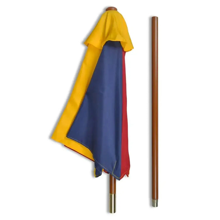 Children’s rainbow parasol with yellow, blue, and red fabric and wooden pole on white background
