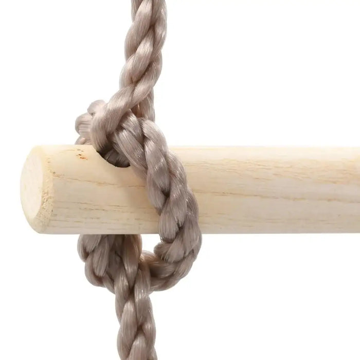 Close-up of a solid pine wood kids rope ladder rung with thick PE rope knot