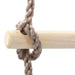 Close-up of a solid pine wood kids rope ladder rung with thick PE rope knot