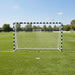 Large metal football goal with weather-resistant net on green soccer field