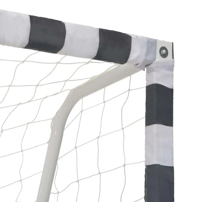 Close-up of metal football goal post with weather-resistant net and striped padding