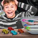 Smiling boy with striped shirt, colorful line following magic doodle cars, LED lights, bowl track