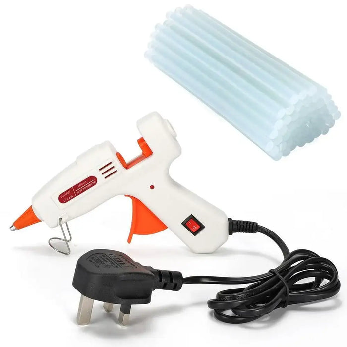 Mini glue gun with UK plug, orange trigger, and bundle of clear glue sticks for crafts.
