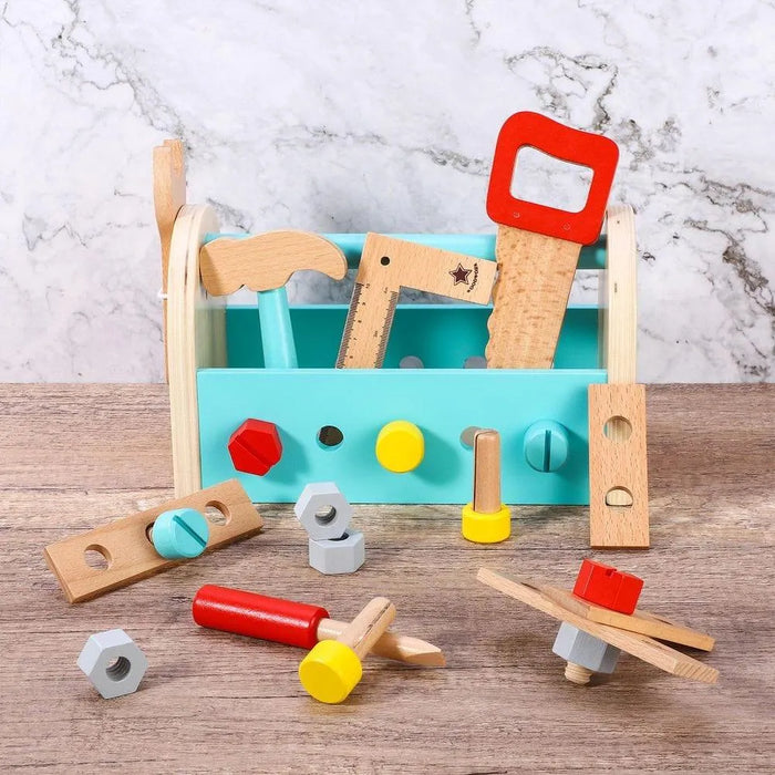Colorful wooden toy tool box set with hammer, saw, nuts, and bolts on a wood surface