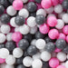 Close-up of pink, white, and gray plastic play balls for a ball pit
