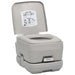 Grey portable camping toilet with instruction label and pull handle, indoor studio lighting