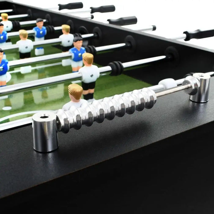 Black finish professional football table with adjustable height and players on green field