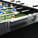 Black finish professional football table with adjustable height and players on green field