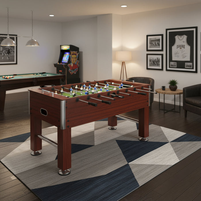 Professional brown foosball table on geometric rug in modern game room with wall art