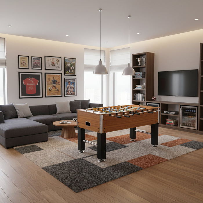 Professional light brown foosball table with black legs in modern living room
