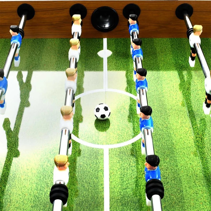Professional foosball table with green pitch, blue and white players, and soccer ball