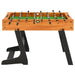 Competition-grade foosball table with wood frame and black legs for games room