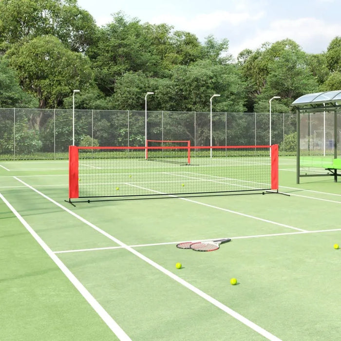 4m steel frame tennis net with red posts on outdoor court, carry bag not visible