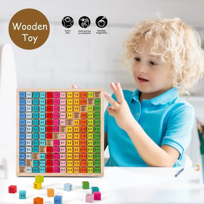 Child playing with colorful wooden multiplication table learning blocks on a table.