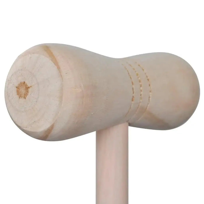 Close-up of wooden croquet mallet head, smooth natural finish, garden game equipment