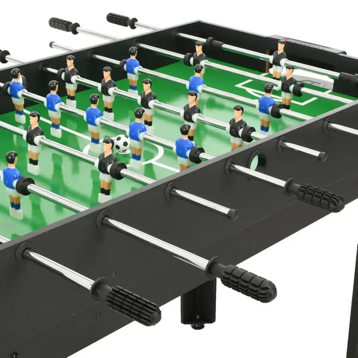Black multi-game foosball table with player figures on green field and chrome handles