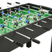 Black multi-game foosball table with player figures on green field and chrome handles