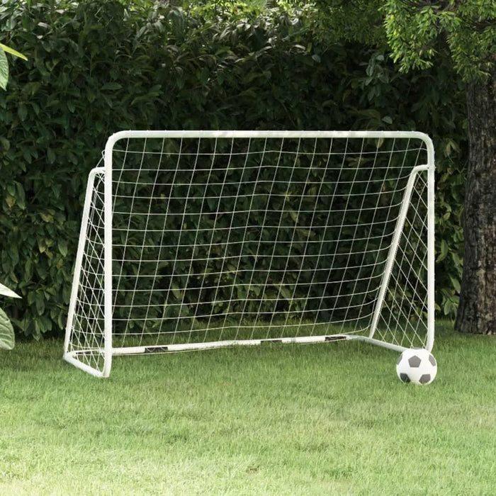 White steel football goal with net and soccer ball on green grass outdoors