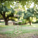 Wooden 4-sided rope ladder with five pine steps hanging outdoors from a tree branch