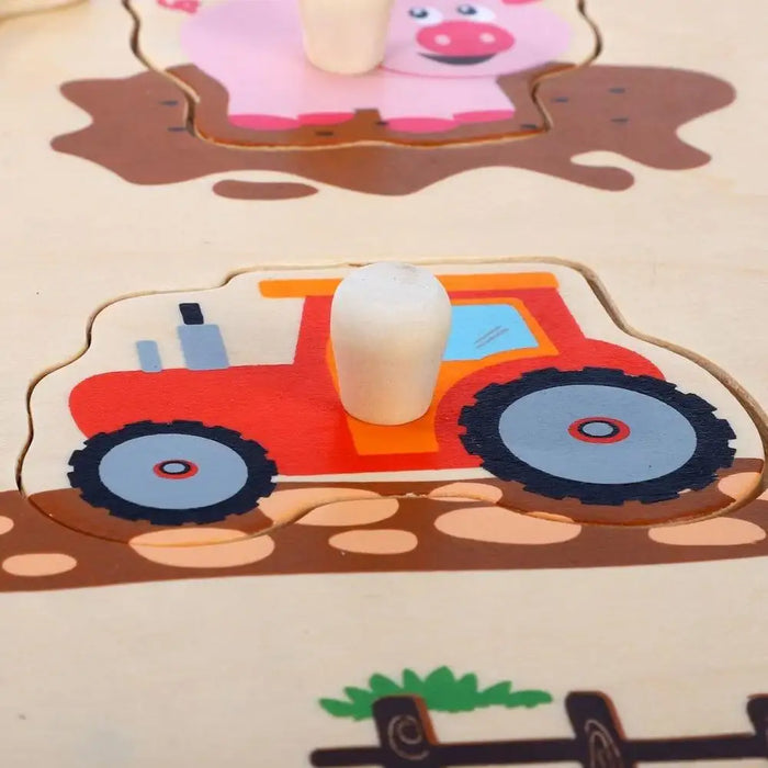Wooden farm animal puzzle peg board with red tractor and pink pig pieces