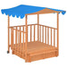 Wooden playhouse with sandbox base, blue UV50 canopy, and mobile wheels