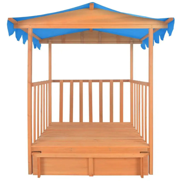 Wooden playhouse with sandbox, blue UV50 canopy, and open railings for kids
