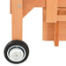 Close-up of wooden playhouse frame with black wheel and metal hardware