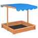 Wooden sandbox with blue adjustable roof and firwood frame for outdoor play