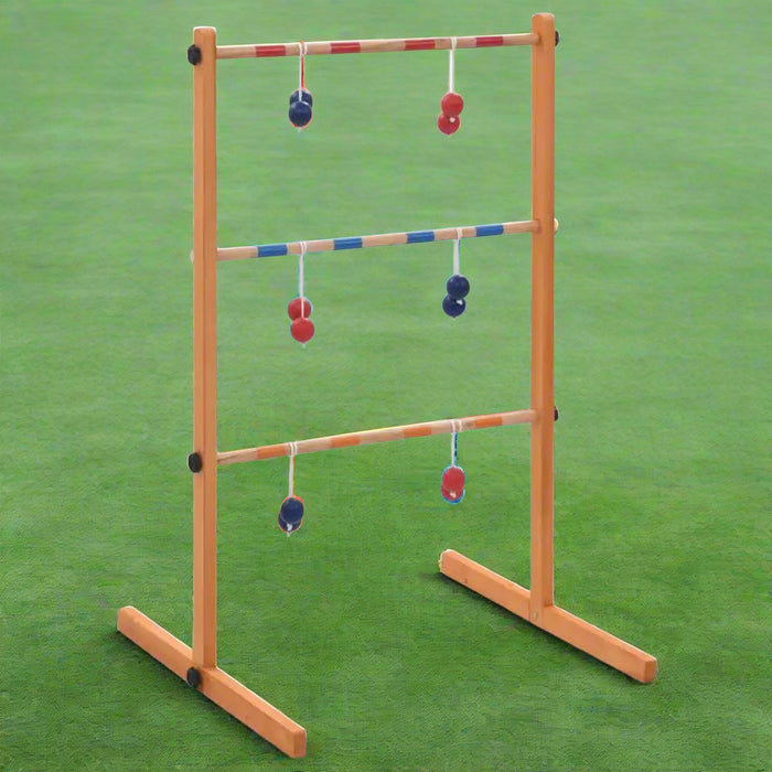 Wooden ladder toss game with red and blue bolas on green grass
